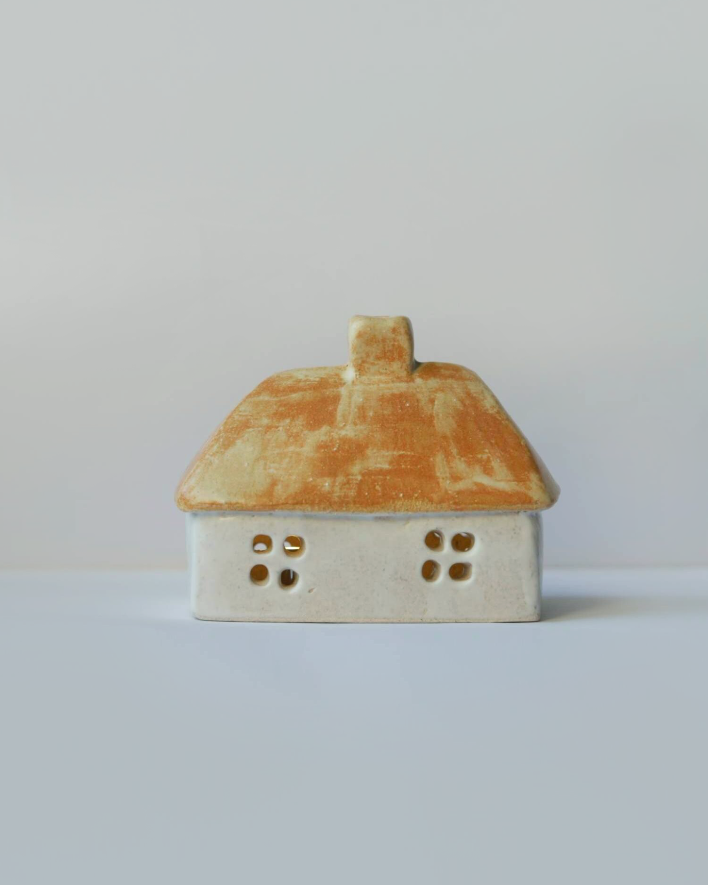 Ceramic house with beige-orange roof