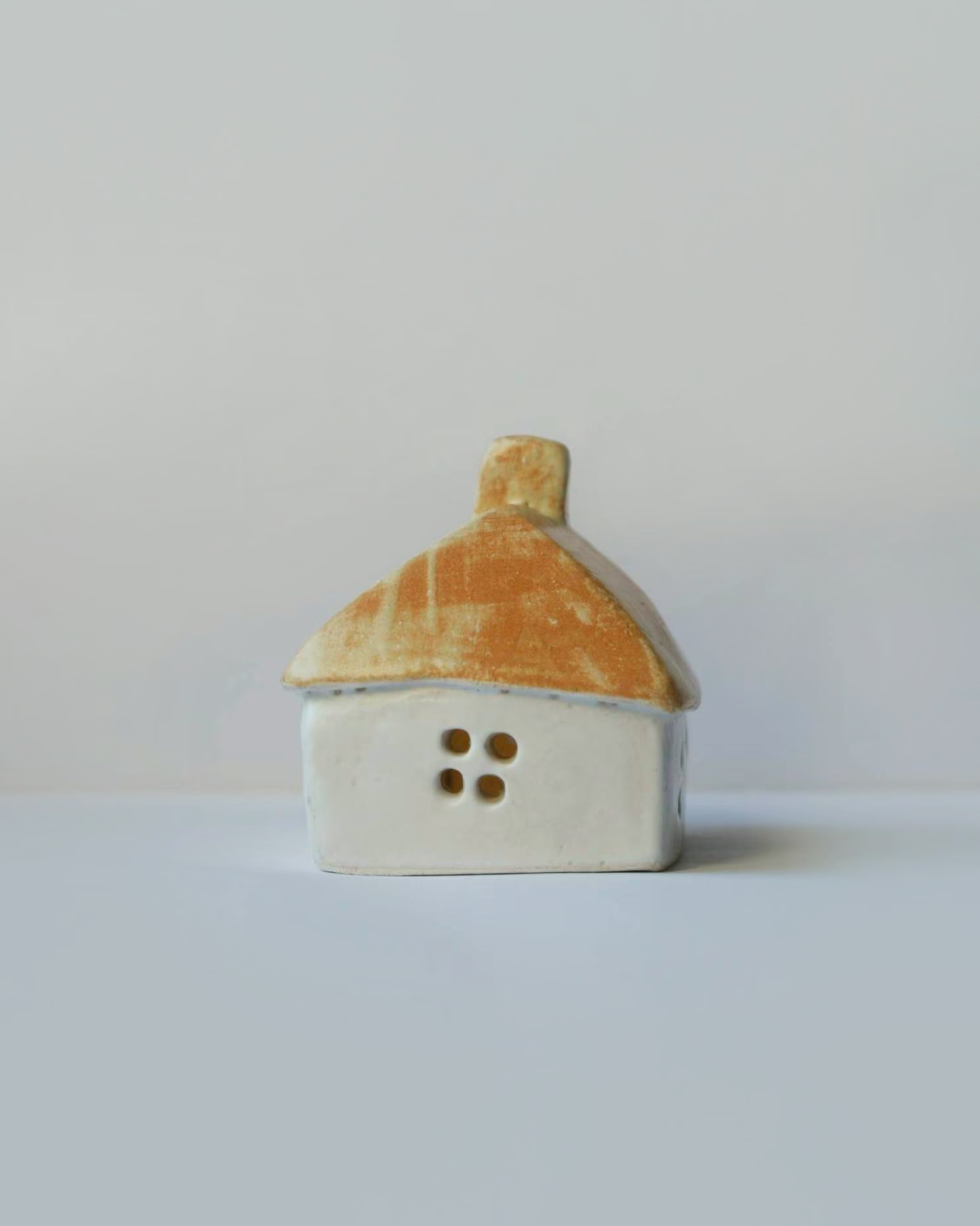 Ceramic house with beige-orange roof