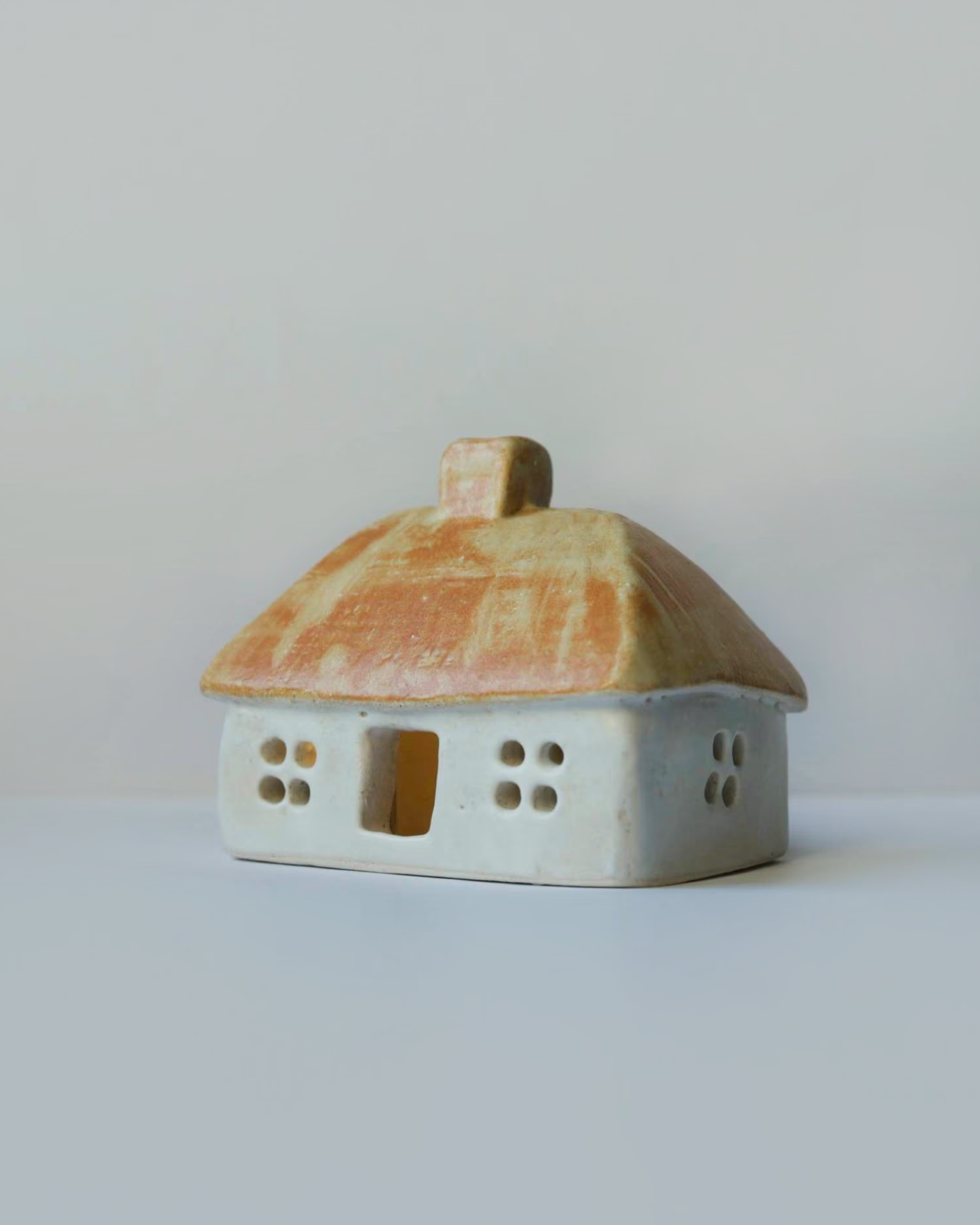 Ceramic house with beige-orange roof