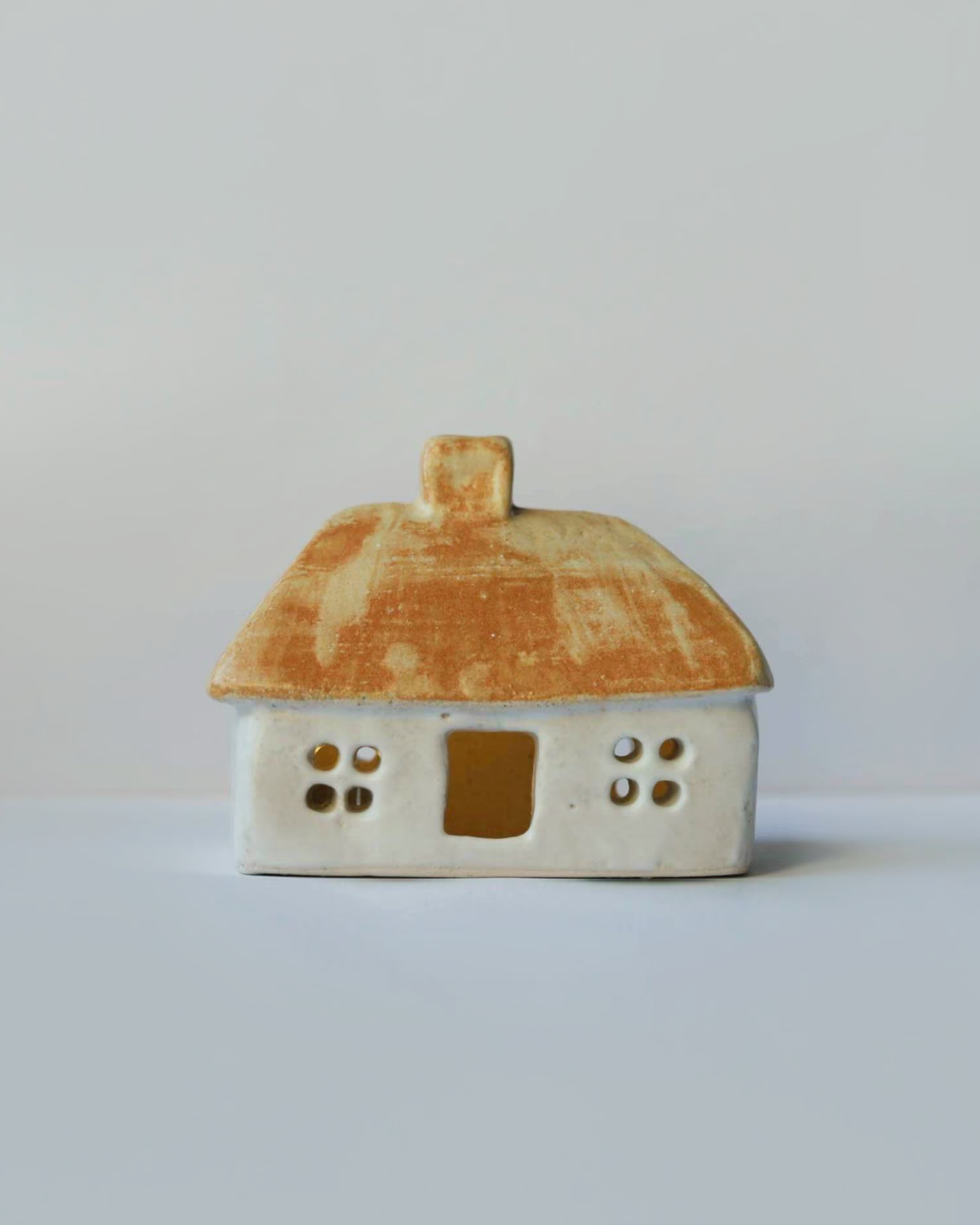 Ceramic house with beige-orange roof