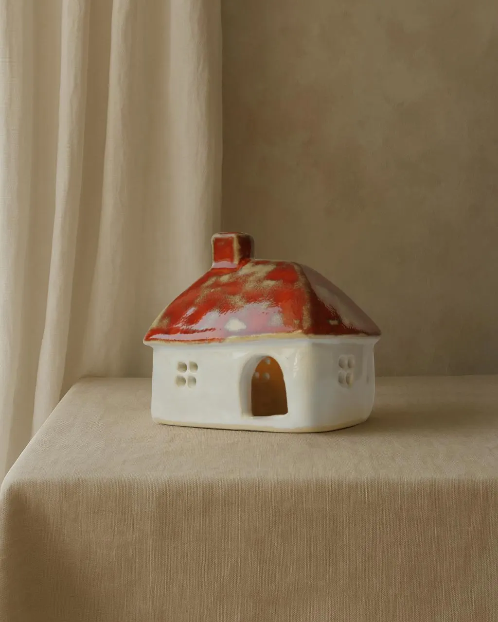 Ceramic house with orange roof