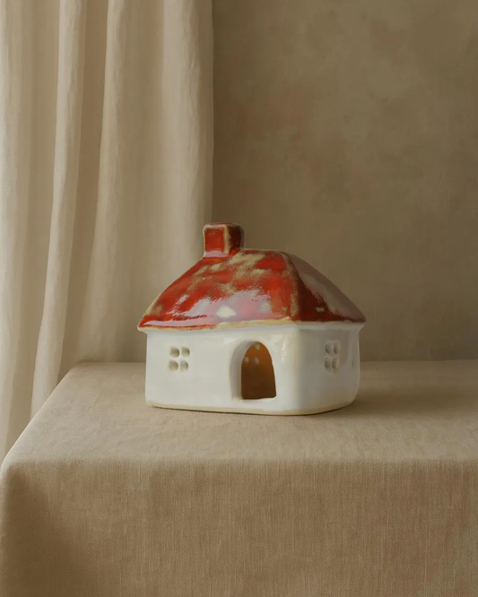 Ceramic house with orange roof