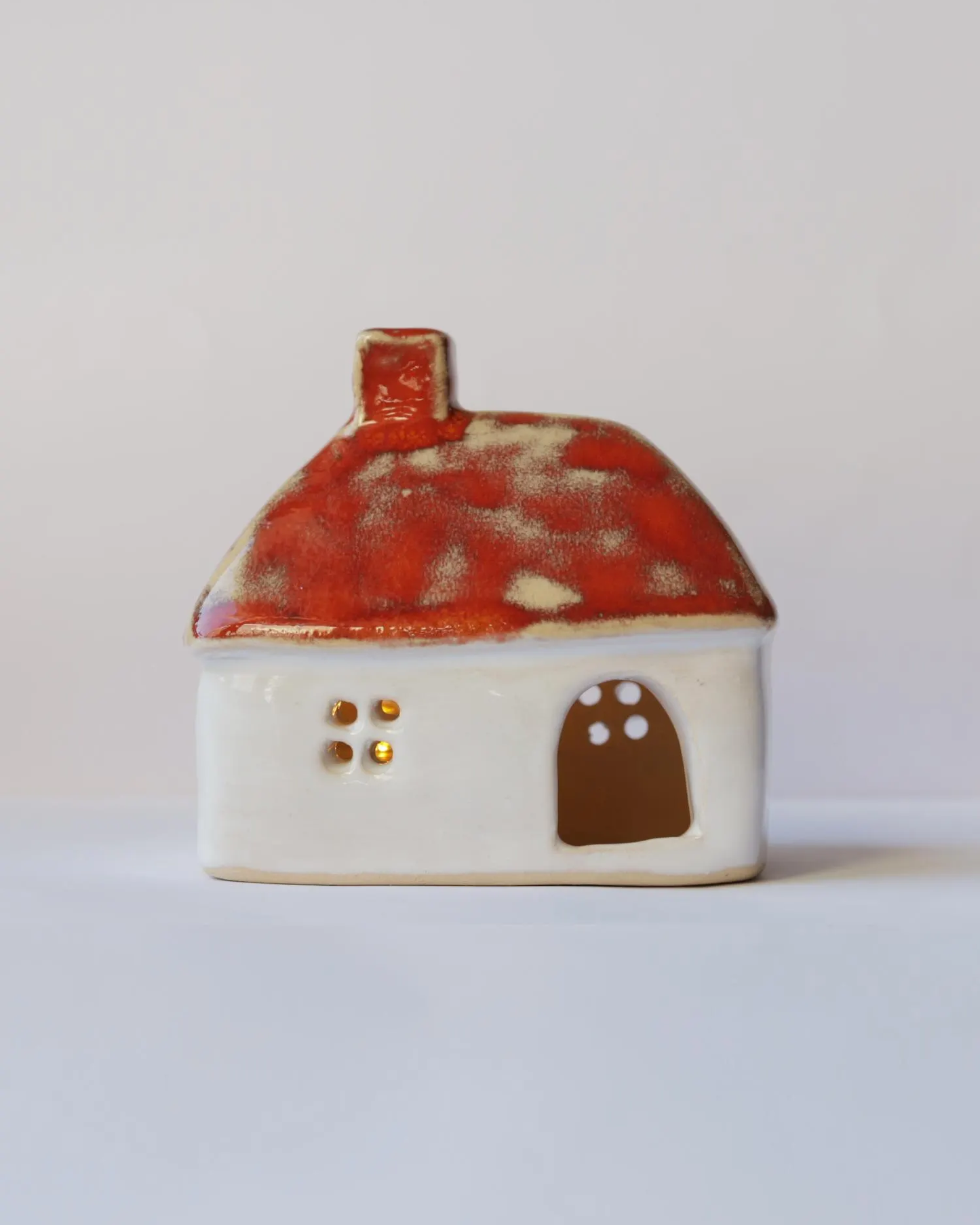 Ceramic house with orange roof