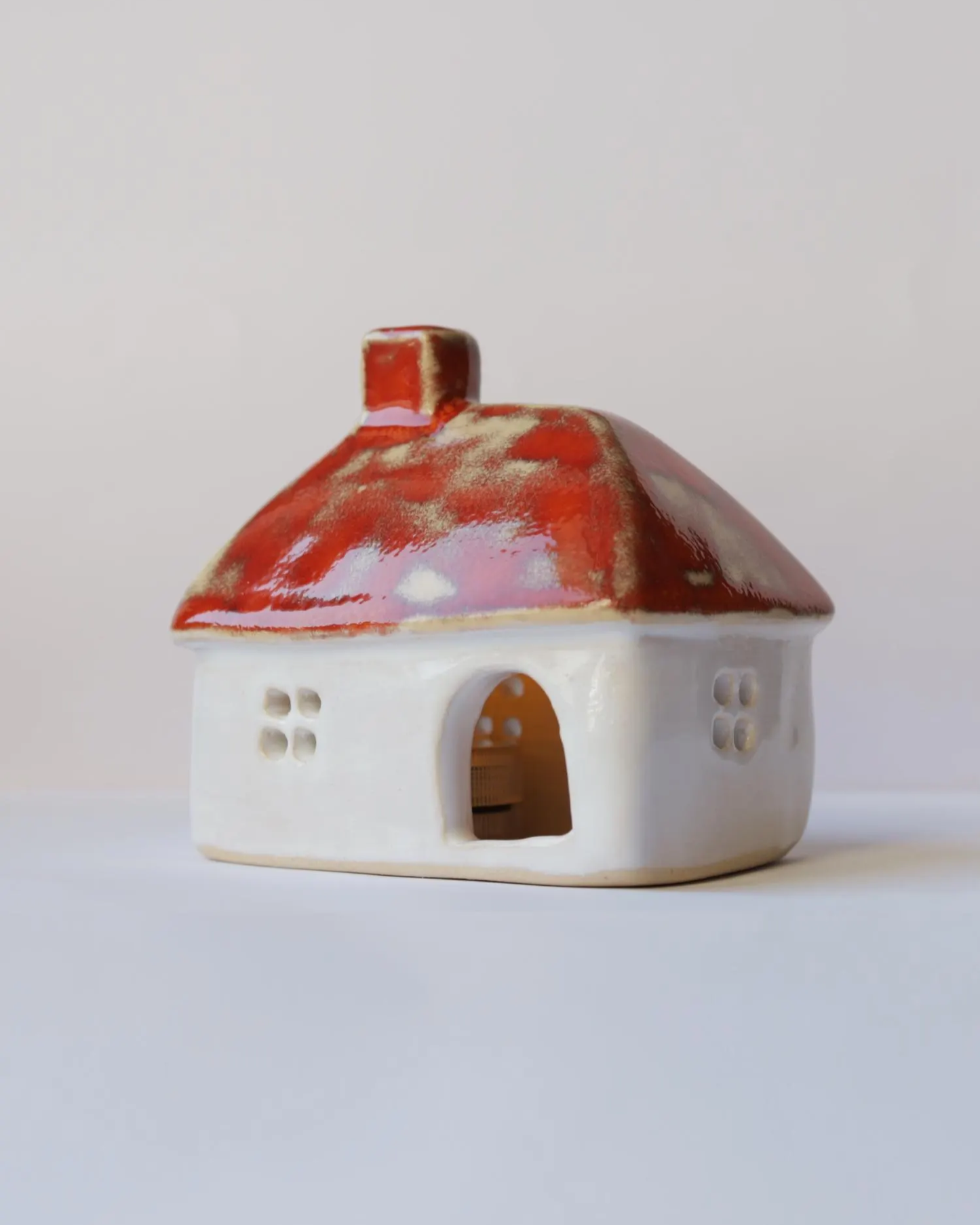 Ceramic house with orange roof