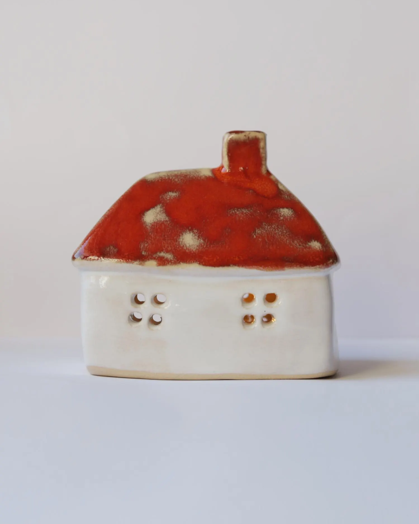 Ceramic house with orange roof
