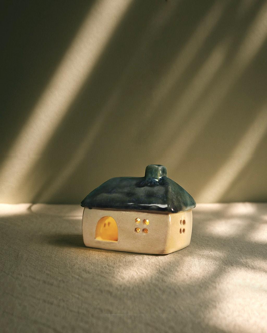 Ceramic house with blue-green roof